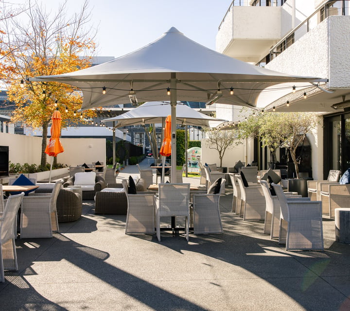 Outdoor seating at Hotel Montreal on a sunny day.