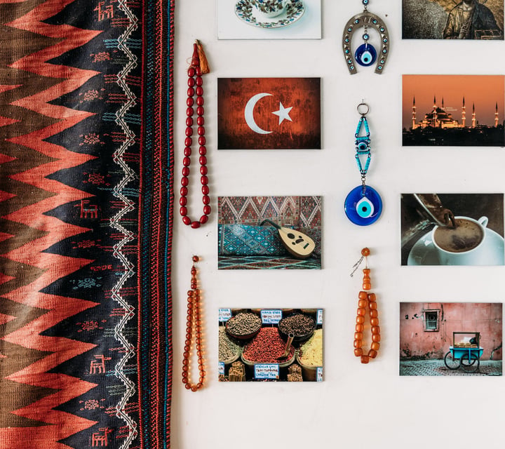 Turkish postcards and colourful beads on wall