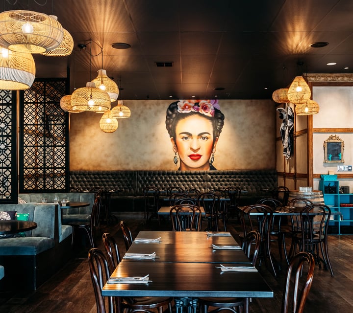 Frida Kahlo poster on the wall in the dining room of Libre.