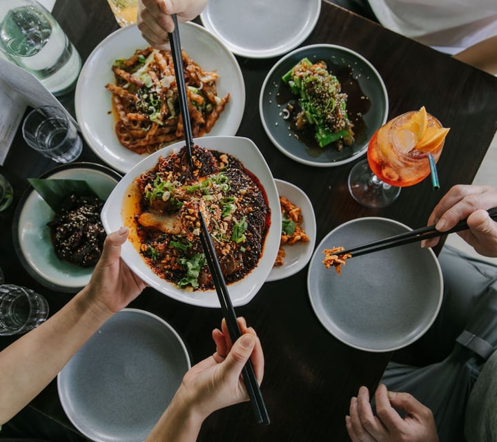 Birds eye view image pf a table filled with plates of food.