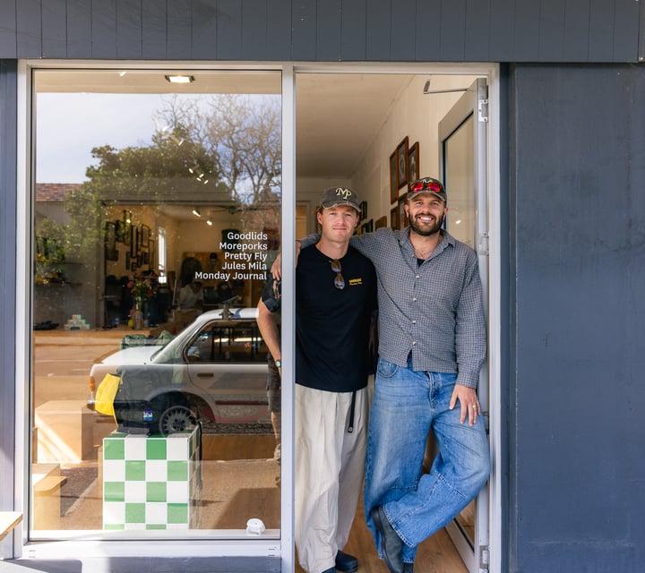 Owners of Outdoors Society standing in entranceway of shop in Auckland