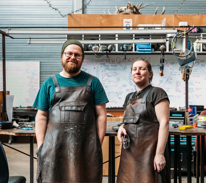 A man and woman looking at the camera.