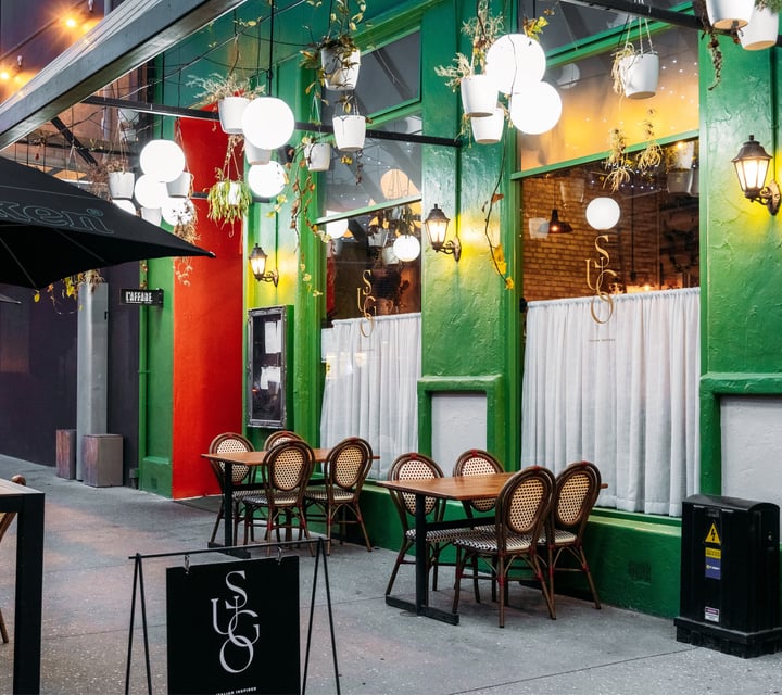 The green exterior of an Italian-style restaurant in Tauranga.