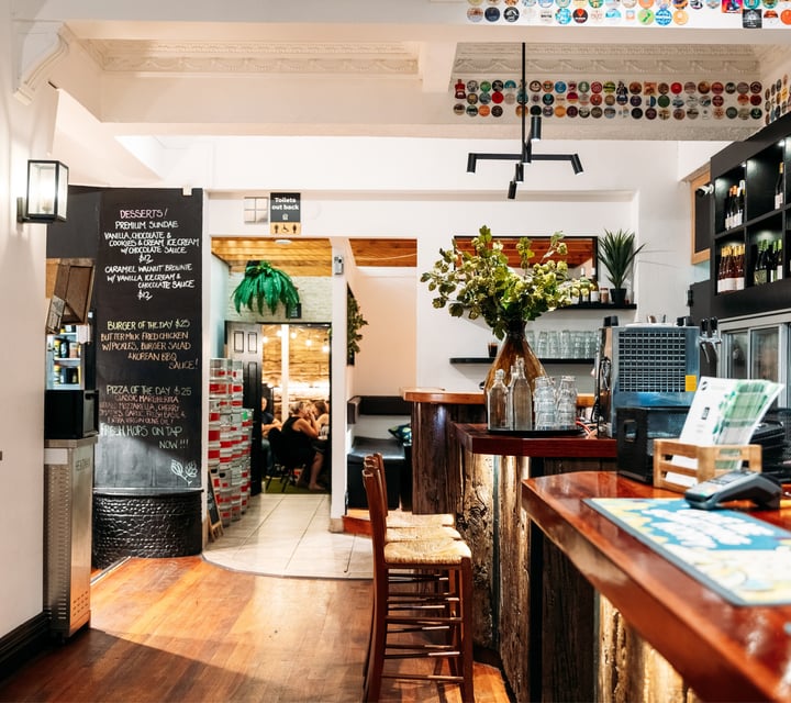 The bar seating area inside The Hop House Tauranga.