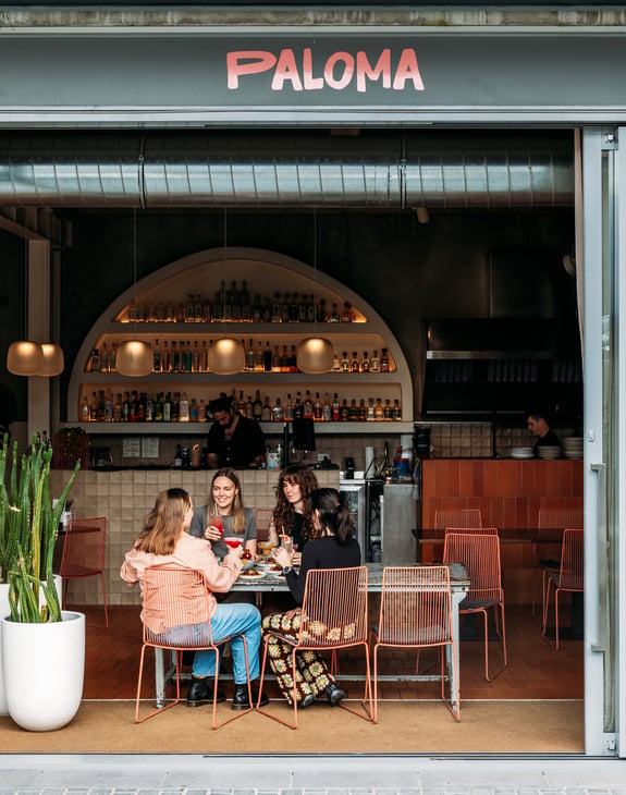 People sitting at a table at Paloma.