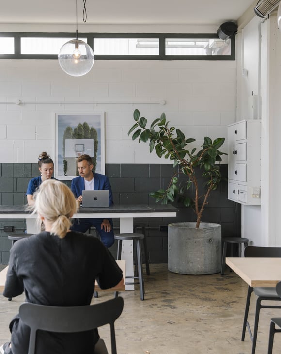 People working in a cafe.