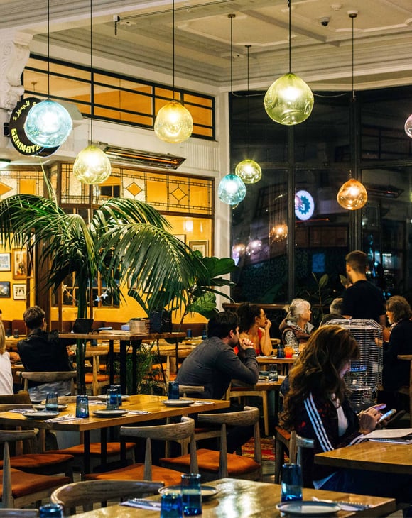Customers dining under colourful bulbs at Gemmayze Street in Auckland.