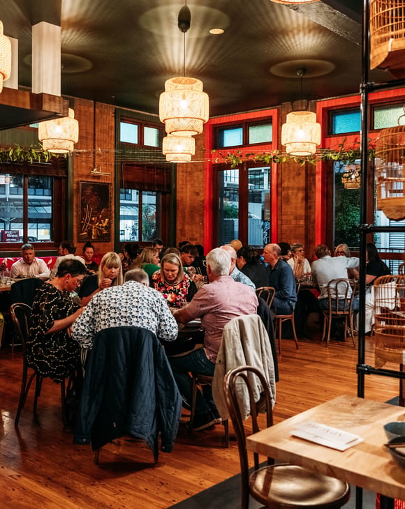 Dining room full of customers in Apache.