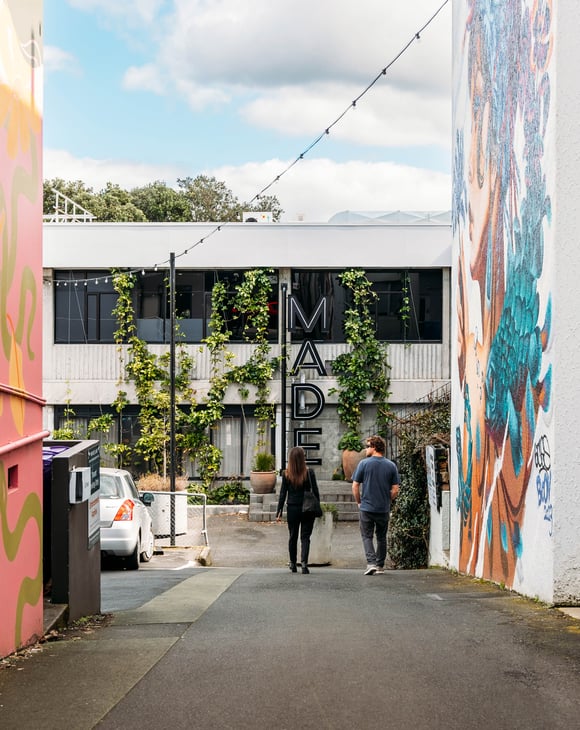 Couple strolling down MADE laneway.