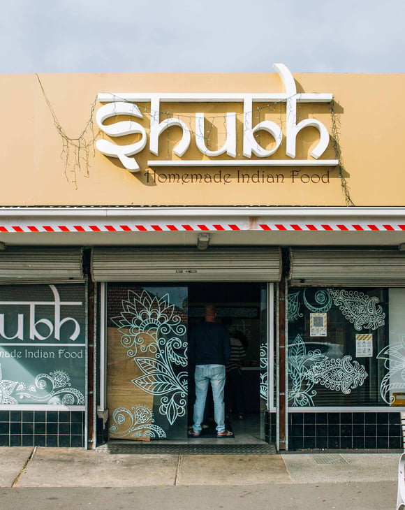 The entrance to a restaurant on a sunny day.