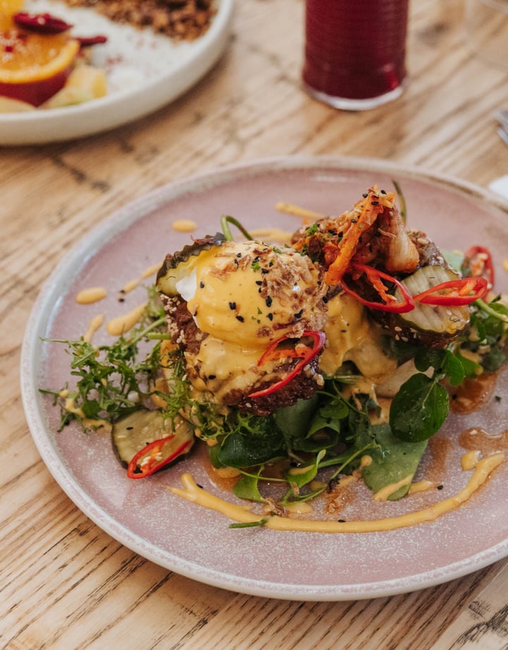 A plate of brunch on a table at Buster Greens.