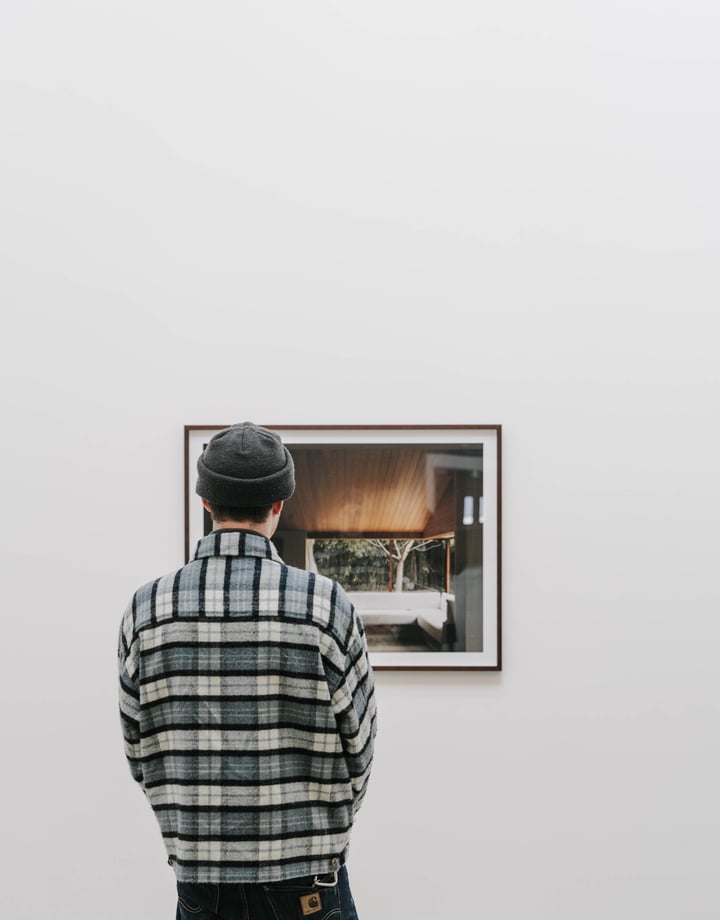 Man looking art at CoCA.