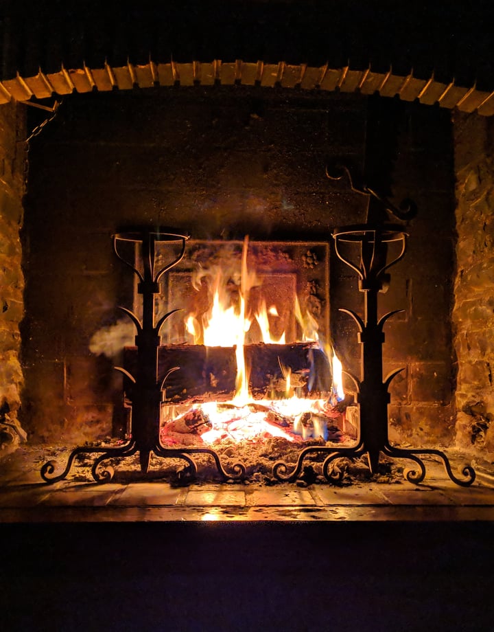 Roaring fire in fireplace by Stephane Juban.