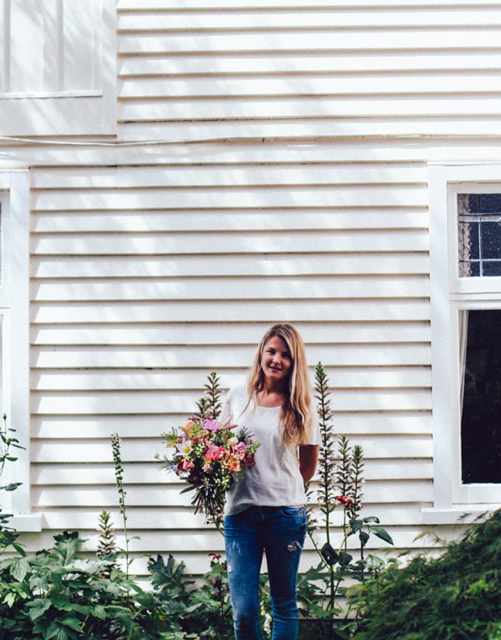 A photo of Natalie-Rose holding a bunch of flowers.