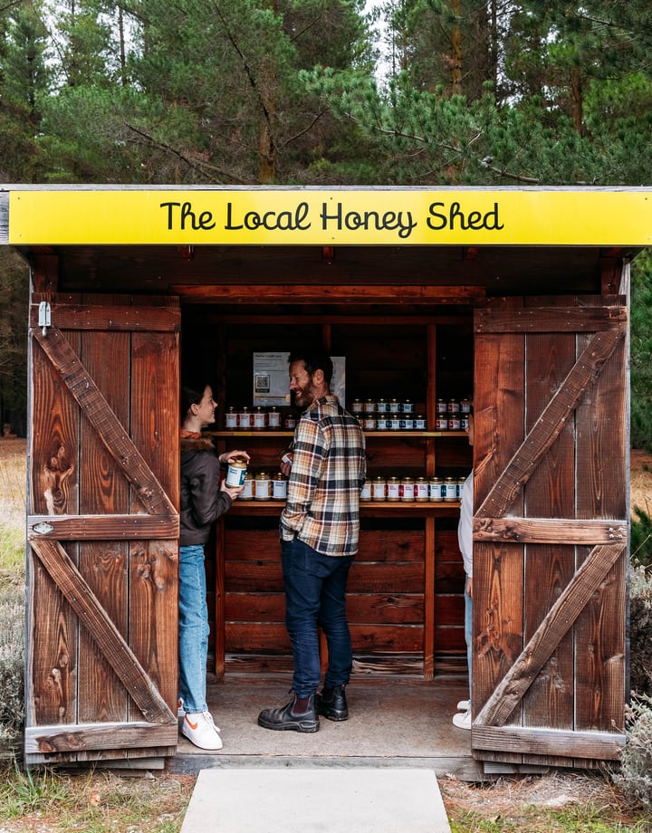 Two customers inside the roadside stall of Forage and Gold.