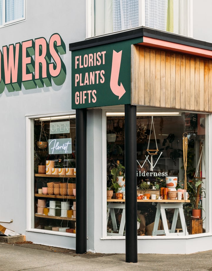 The green, pink and grey exterior of The Wilderness florist store in Paraparaumu.