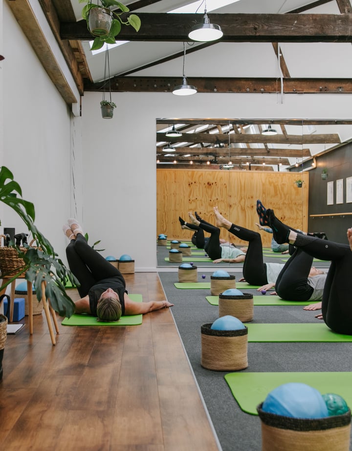 A pilates class in action at Well Studio.
