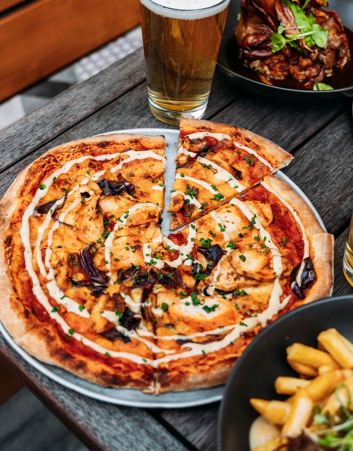 Pizza and other food on the table.