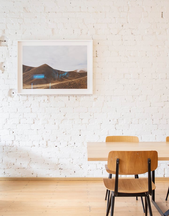Tables and chair inside Daily Bread Auckland on a sunny day.