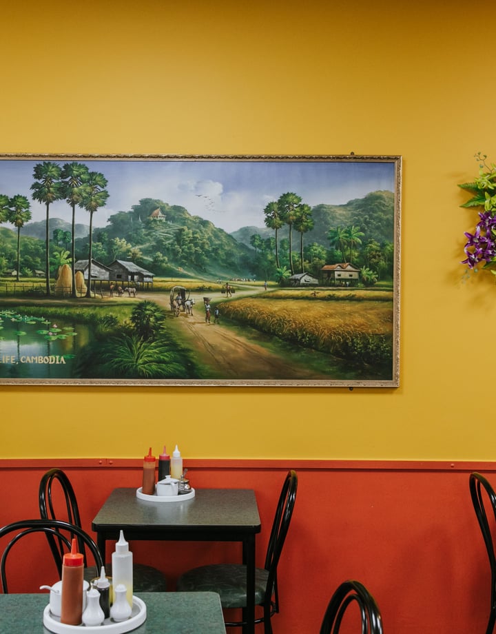 Inside Chinese Restaurant with dining table and yellow and red painted wall