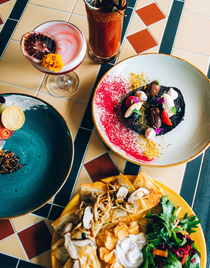 Mexican meals on colourful plates.