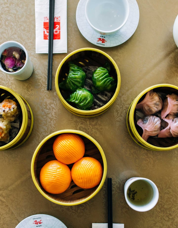 A flatlay of bowls of Chinese food at Dragons Wellington.