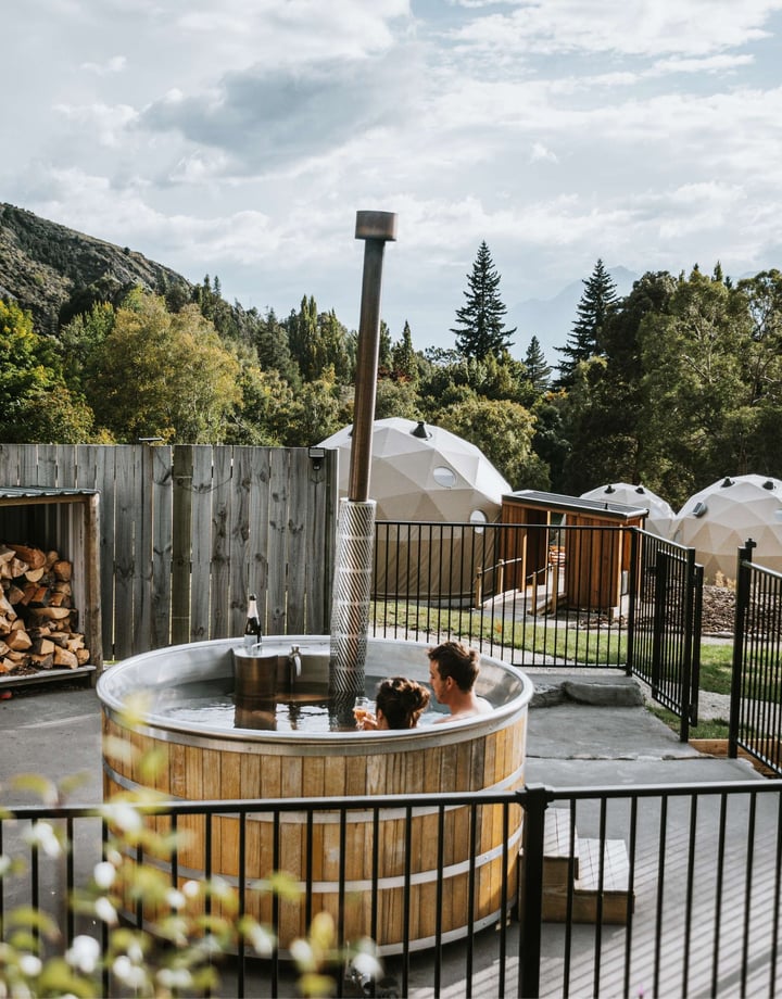 Two people in a hot tub at Cross Hill in Lake Hawea.