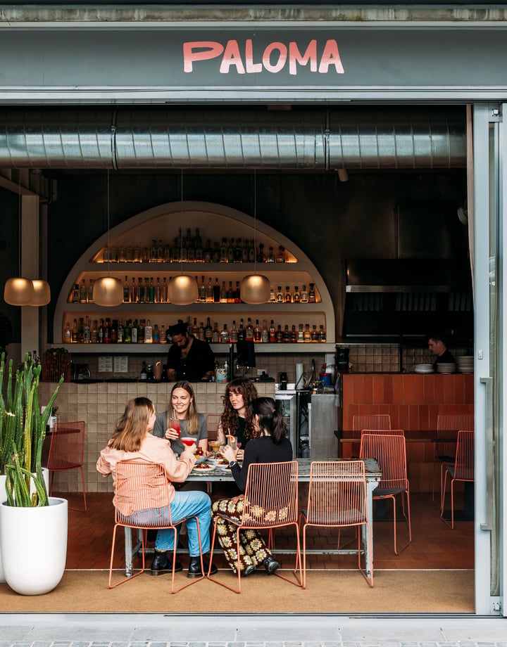 People sitting at a table at Paloma.