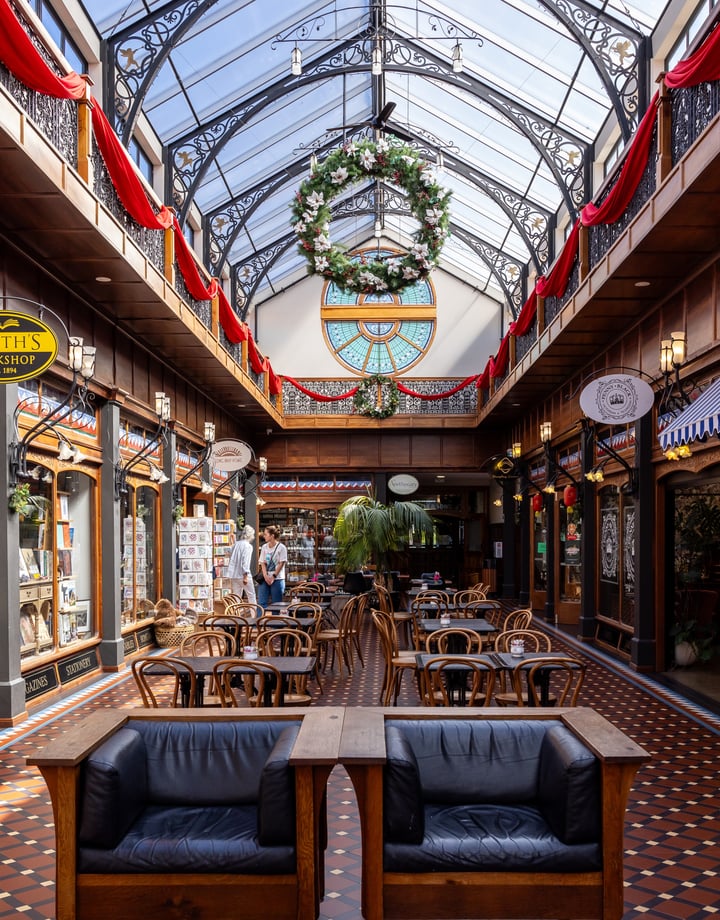 Entrances to various shops in the atrium of The Tannery.