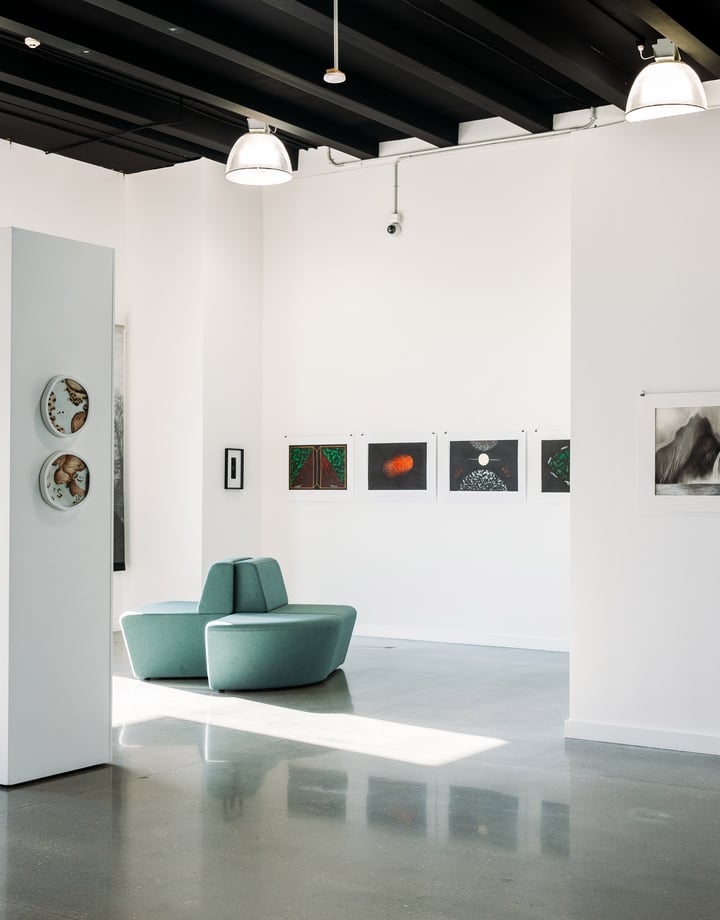 The white crisp interior of an art gallery.
