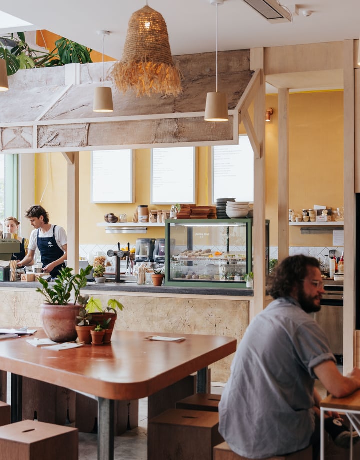 People working inside a busy cafe in Christchurch's South Town.