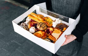 Close up of pastries in a box.