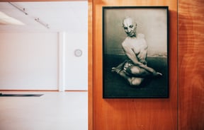 A print on the wall and entrance to studio.
