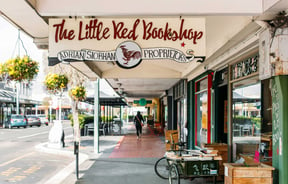 The exterior signage of The Little Red Bookshop in Hastings.