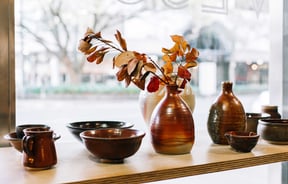 Pottery in window display.