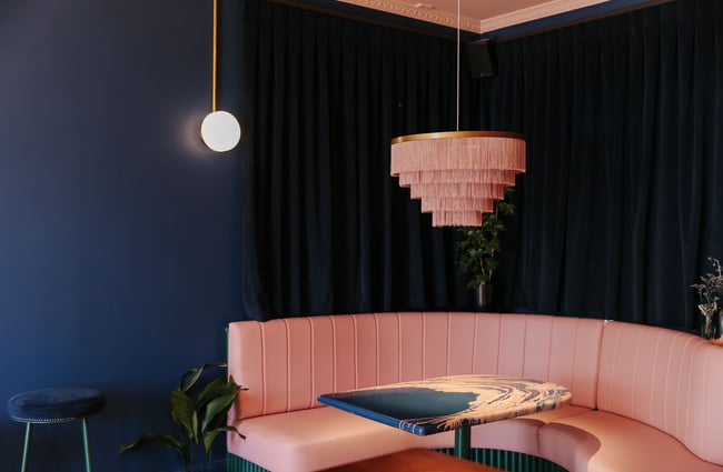 Pink leather booth seating area at gin gin in Christchurch.