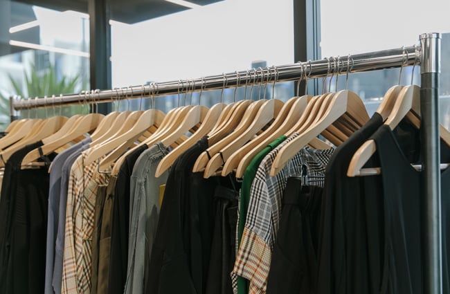 A close up of a rack of clothes.