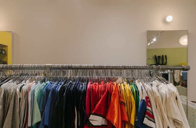 Rack of colourful men's t-shirts.