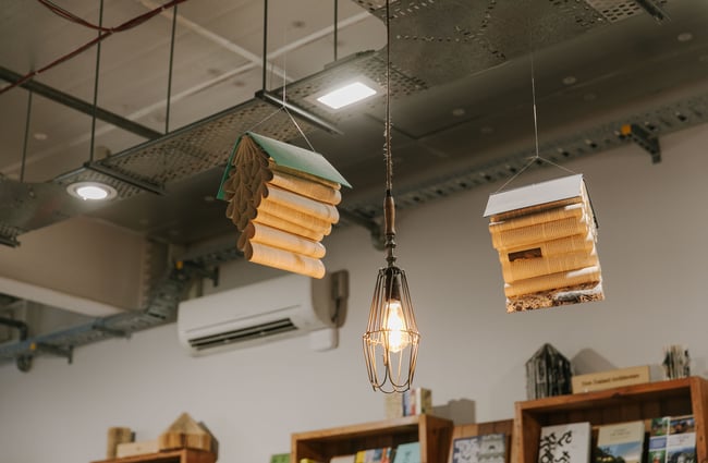 Old books hanging from the ceiling.