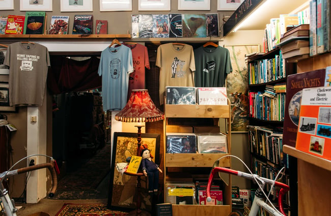 Old t-shirts and records on display in a corner of the store.