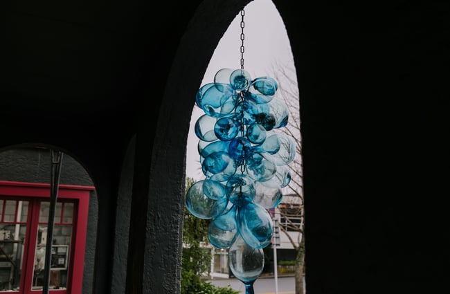 Blue artwork at the entrance of flamedaisy.