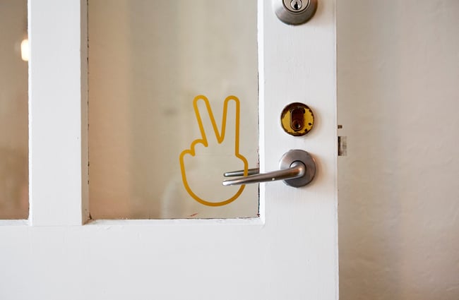 A peace sign on a door of Frank's Newtown cafe in Newtown Wellington.
