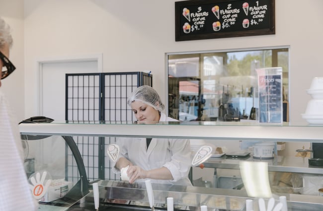 Woman serving behind the gelato counter at Gelato Lab in Christchurch.