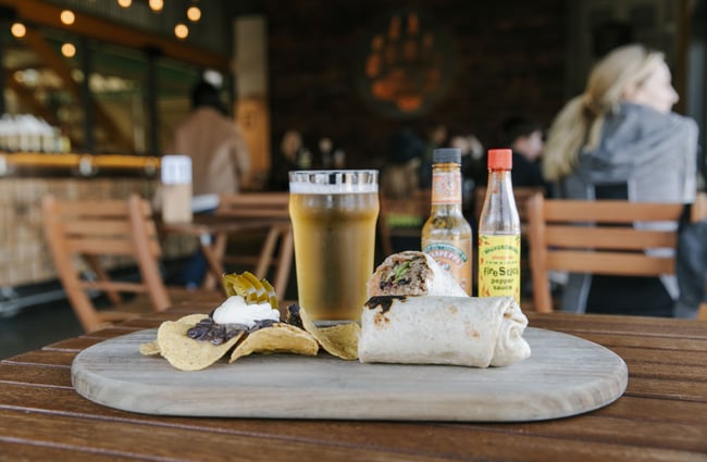 Burrito and beer on the table at Golden Bear Brewing Company, Māpua Tasman.