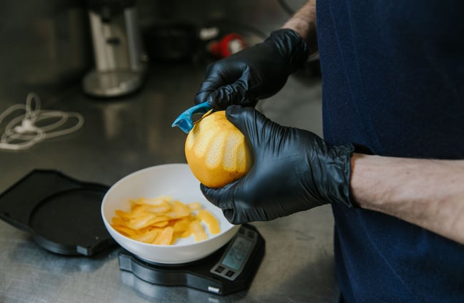 A close up of a lemon being peeled at Humdinger Gin Distillery in Geraldine.