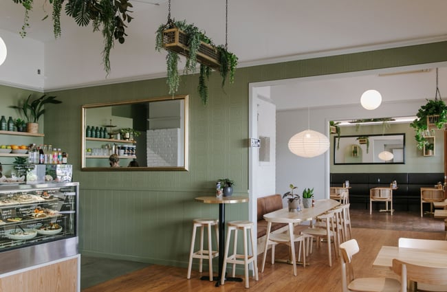 The green, brown and white cafe interior.