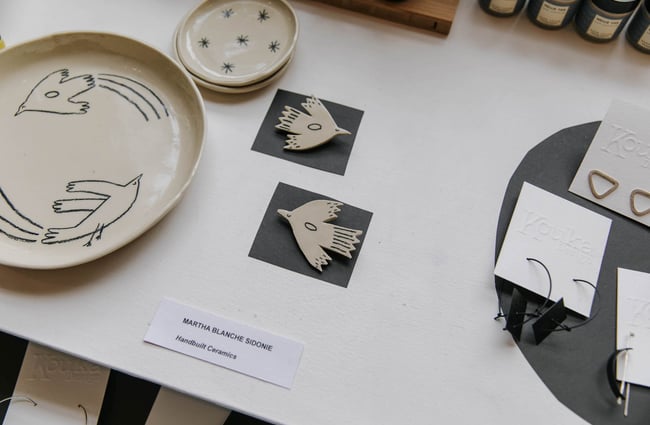 Hand-built ceramic bird badges at Red Gallery and Cafe.