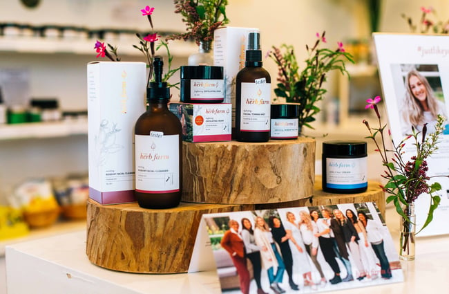 Skincare products displayed on wooden blocks.