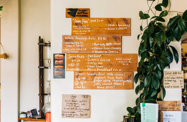 The menu on wooden wall signage.