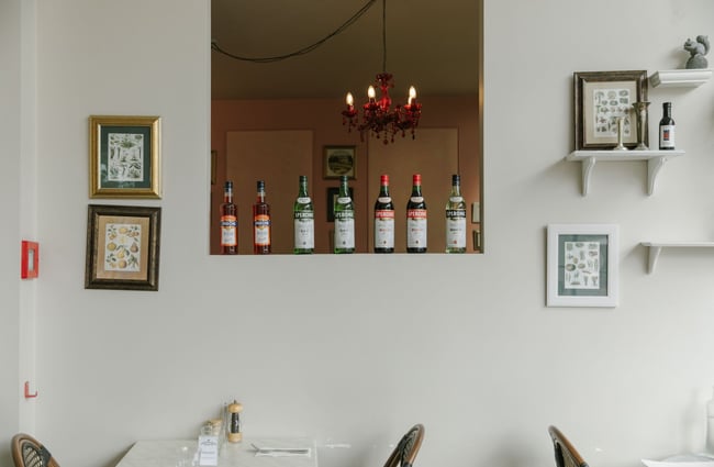 Italian aperitif bottles displayed on an internal wall cut-out at The Mediterranean Food Company, Christchurch.